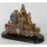 A large Victorian gilt metal and ormolu Mantel Clock, surmounted with Virgin & Child Jesus,