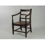 A 19th Century elm and oak Country Armchair, with solid seat.