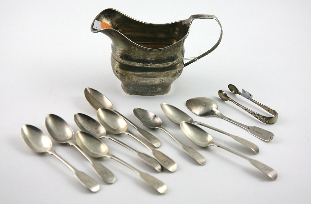 An Irish Georgian bright cut Cream Jug, a set of 8 English silver Teaspoons, London c.