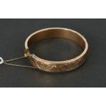 An engraved hinged 9ct gold Box Bangle, hallmarked Chester, approx. 18 grams.