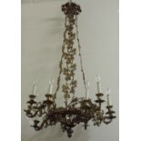 A large 12 branch ormolu Chandelier, with leaf moulded ceiling rose and chains,