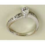 An attractive white gold and diamond Engagement Ring, with approx. .