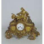 A large 19th Century French ormolu Mantle Clock, with elegant figure and dog surmounted,