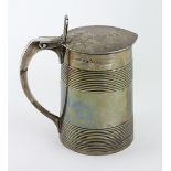 An important heavy George III English silver Tankard, the hinged lid with an engraved coat of arms,