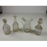 An antique cutglass triple-ring neck Decanter, and matching stopper, two other cutglass Decanters,