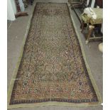 A large 19th Century Oriental Runner, with multiple borders and designs,