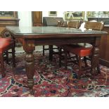 A large late Victorian telescopic walnut Dining Table, with one spare leaf,