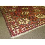 A rust ground Bokhara Rug, approx.