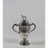 A large Irish silver two handled Trophy Cup and Cover,