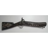 An early 19th Century Flintlock Blunderbuss, of short form and Eastern design,