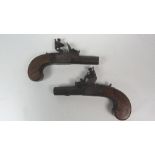 An almost matching pair of late 18th Century flintlock box lock Pocket Pistols, with screw barrels,