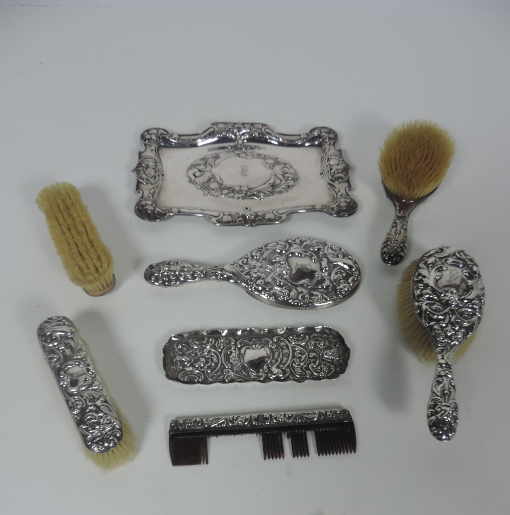 A mixed but very attractive early 20th Century silver Dressing Table Set,