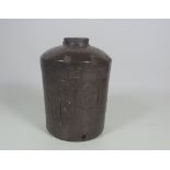 A large purple glazed Oriental Water Jar, decorated with Chinese character marks,
