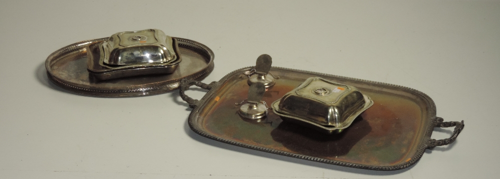 An early large two handled silver plated Tray, with heavy gadroon border and floral scroll handles,