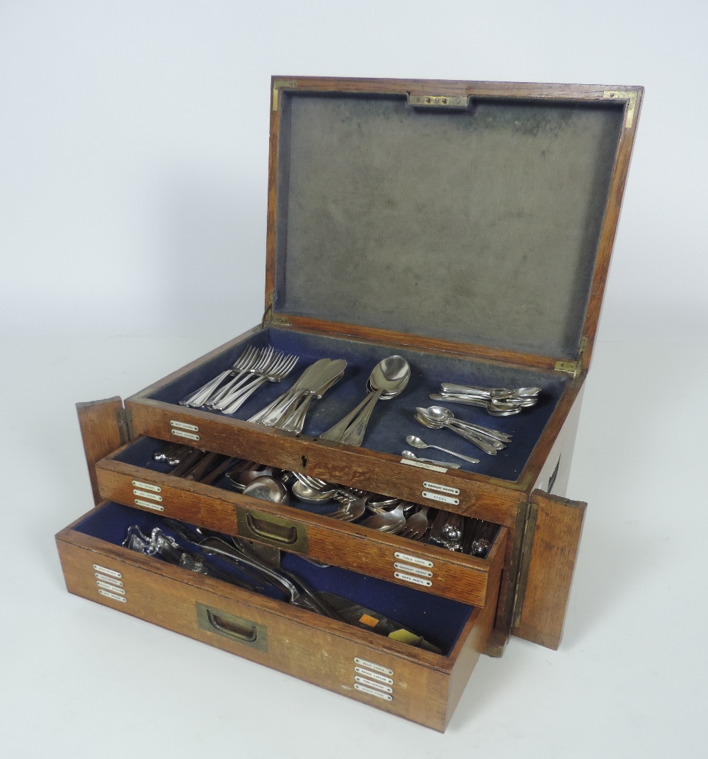 An oak Cutlery Canteen, by Cross Brothers, Cardiff, with a part service, kings pattern design,