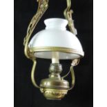 A brass Ceiling Light, with milk glass shade.