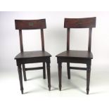 A very good pair of early 19th Century Irish mahogany armorial Hall Chairs,
