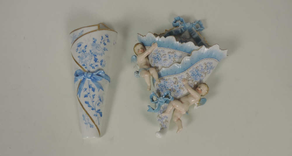 A large 19th Century Continental porcelain Posy Holder, decorated in blue and with Adams love knots,