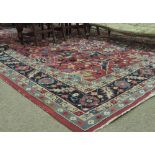 A very attractive late 19th Century claret ground Carpet,