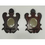 An attractive pair of carved Edwardian mahogany shield shaped Wall Brackets,