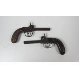 Two similar antique percussion box lock Picket Pistols, one with chequered grip, each approx.