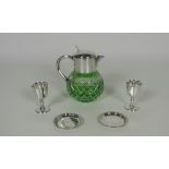 An unusual green cutglass Punch Jug, with heavy silver plated mount and handle,