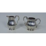 An attractive two handled Birmingham silver Sugar Bowl, and matching Cream Jug,