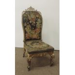 An early Victorian carved giltwood Nursing Chair,