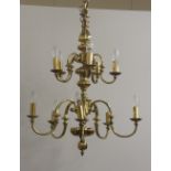 An attractive heavy brass graduating two tier, ten branch Ceiling Light, 109cms (43") high.