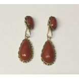 An attractive large pair of 12ct gold Ear Rings, inset with coral cabochon stones.