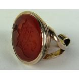 A good large Irish 19th Century oval 9ct gold Seal, with the arms of Weir engraved on carnelian,
