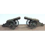 A large pair of ornate heavy cast brass Cannon Guns, on original stands, 37" long (94cms). O.R.M.
