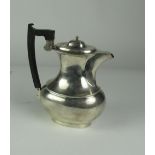 A large plain silver Coffee Pot, Sheffield 1935, with ebony handle, overall weight 21 ozs.