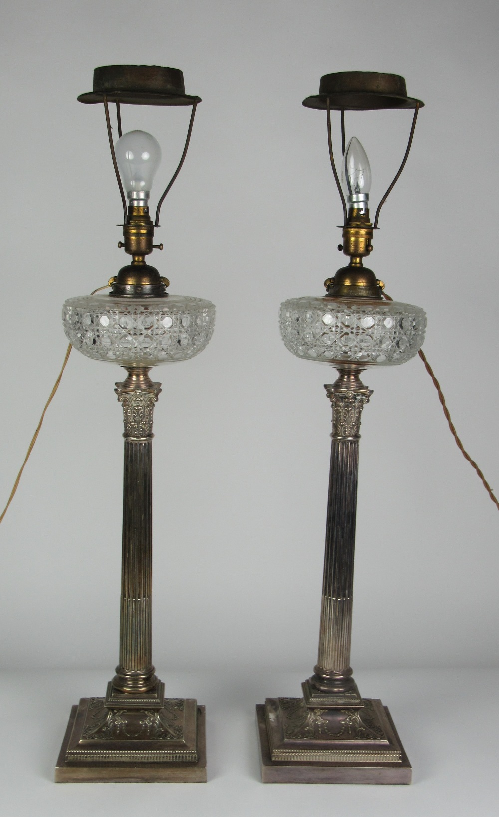 A very fine pair of tall 19th Century silver plated Corinthian style Table Lamps,