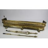 An early 19th Century pierced and decorated brass Fender, with rope edge, on paw feet,