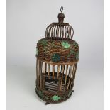 An Edwardian bamboo Bird Cage, decorated with painted ivy leaves.