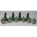 A set of four small Cherub Figures, on malachite bases,