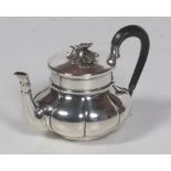 An attractive small melon shaped Continental silver Teapot, with ebony handle,