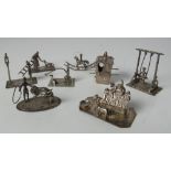 Miniature Silver Toys: A collection of eight silver miniature groups, figures etc.