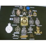 BOARD OF ASSORTED CAP BADGES INCLUDING IRISH