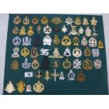 BOARD OF ASSORTED CAP BADGES INCLUDING AUSTRALIA