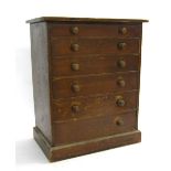 Small pine six drawer watchmaker's chest containing a large assortment of watch parts, movements,