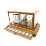 Good walnut cased barograph, within a bevelled glazed case over a sloping plinth base fitted with