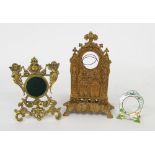 Gilt metal Gothic style pocket watch stand, 8" high; together with a brass neoclassical style Gothic