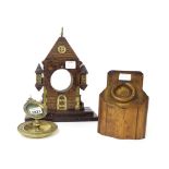 Oak watch stand in the form of a gabled castle gateway, with aperture for a 2.75" dial; also another