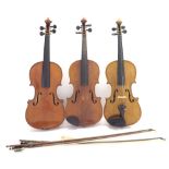 Three early 20th century full size violins, also and three nickel mounted bows