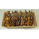 Thirteen various full size violins in need of restoration and setting up; also an old mandolin in