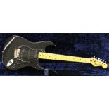 1980s Squier by Fender Stratocaster electric guitar, made in Korea, ser. no. E1008252, black