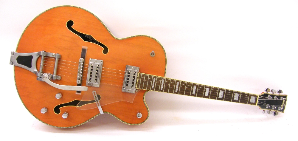Vintage VSA850OR electric archtop guitar, orange finish, electrics appear to be in working order,