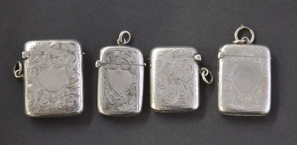 Four silver vesta cases, each with engraved floral decoration, 3oz approx (4)